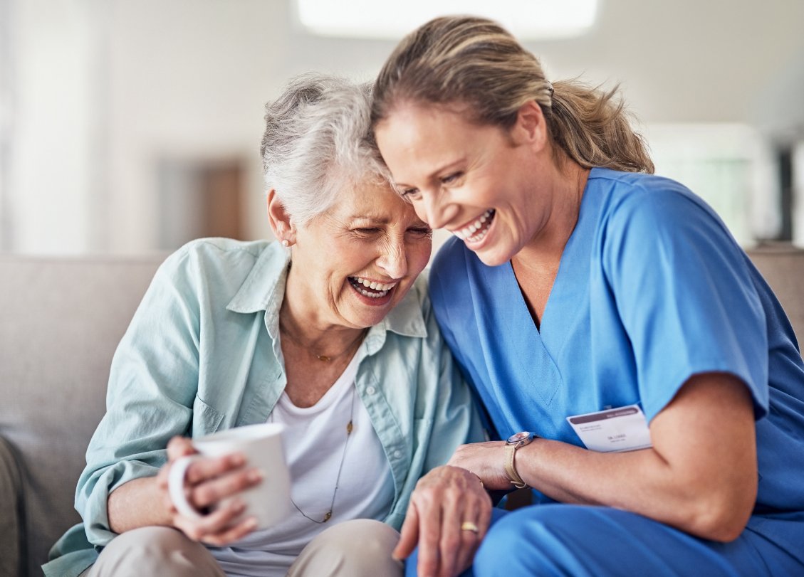 Aster Care Home Sasktoon Respect and Love-nurse and old woman is laughing together in Aster Care Home Saskatoon-Saskatoon